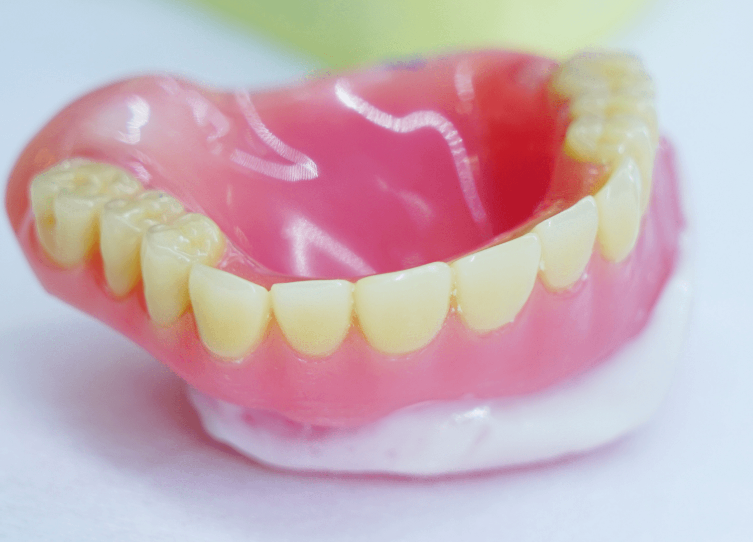 Acrylic full denture with pink base and natural-looking teeth
